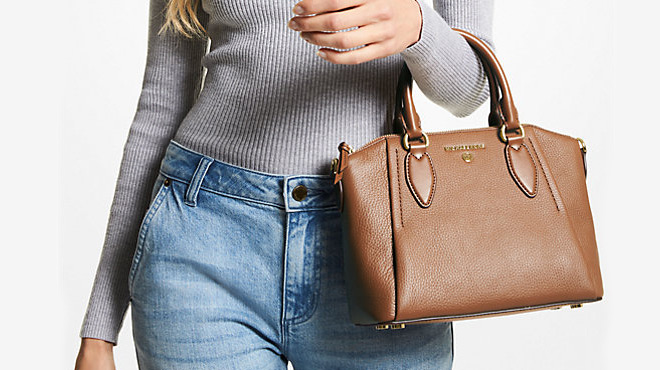 A Person Carrying a Michael Kors Medium Pebbled Leather Satchel