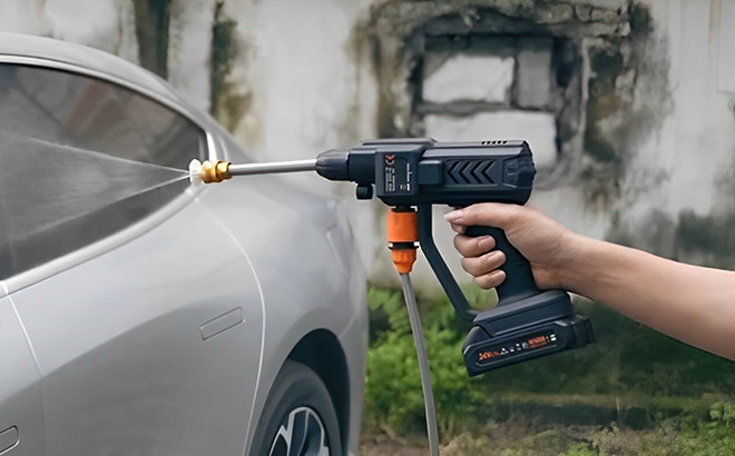 A Person Holding Aumotop Cordless Power Washer