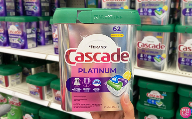 A Person Holding Cascade Platinum 62 Count Dishwasher Pods