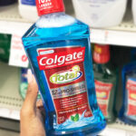 A Person Holding Colgate Total Mouthwash in Peppermint
