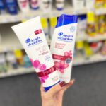 A Person Holding Head Shoulders Shampoo and Conditioner at CVS