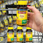 A Person Holding Nature Made Zinc 30mg Tablet at Walgreens