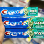 A Person Holding Three Crest Scope Toothpaste Deep Clean Mint