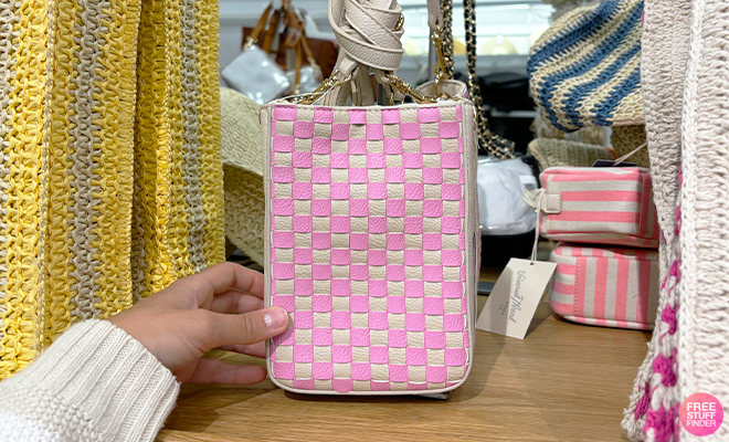 A Person Holding Universal Thread Phone Crossbody Bag in Pink and White at Target