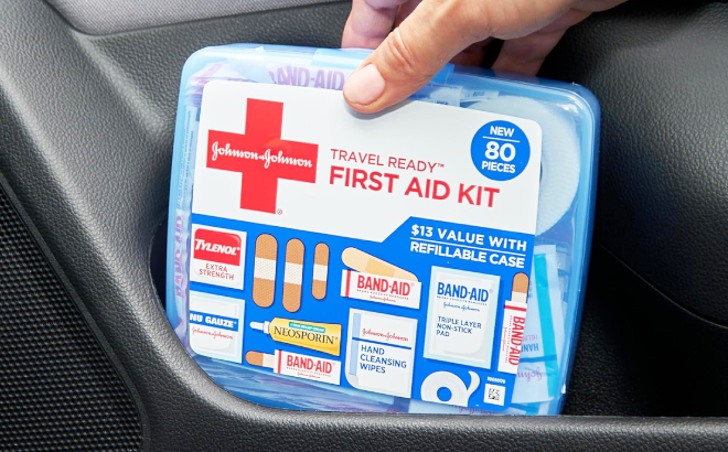 A Person Holding a Band Aid 80 Piece Portable Emergency First Aid Kit