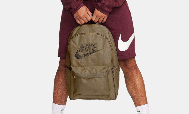 A Person Holding the Nike Heritage Backpack
