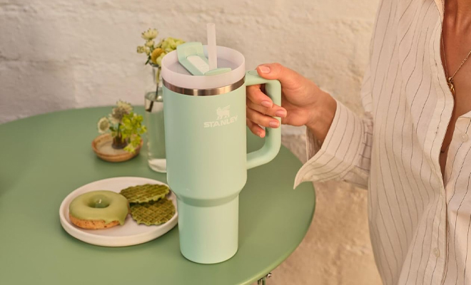 A Person Holding the Stanley Quencher H2 0 FlowState Matcha Collection 40 Ounce Tumbler