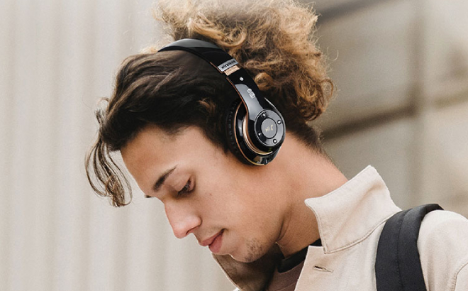 A Person Listening to Music Using Falebare Bluetooth Headphones