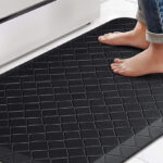 A Person Stepping on a Happy Trends Anti Fatigue Floor Mat