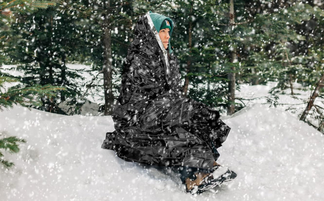 A Person Using Dagmi Outdoors Emergency Survival Blanket