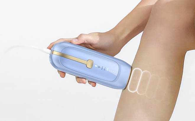 A Person Using Lubex IPL Laser Hair Removal Device on Her Legs