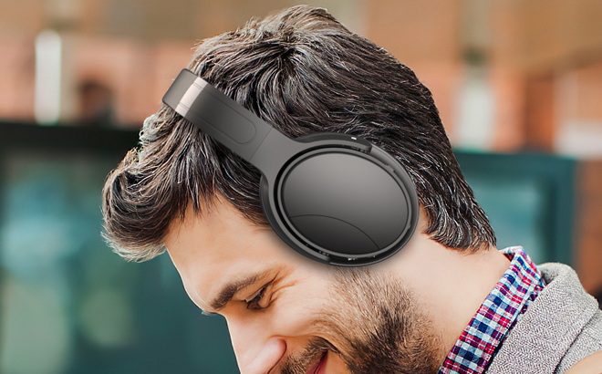 A Person Using Noise Cancelling Bluetooth Headphones