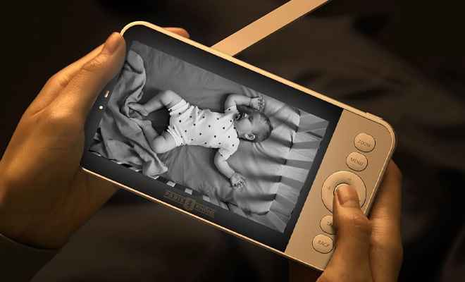 A Person Using the Video Camera Baby Monitor A Person Using the Video Camera Baby Monitor