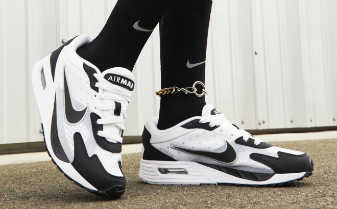 A Person Wearing Nike Air Max Solo Womens Shoes