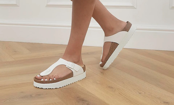 A Person Wearing the Birkenstock Gizeh Platform Sandals in White