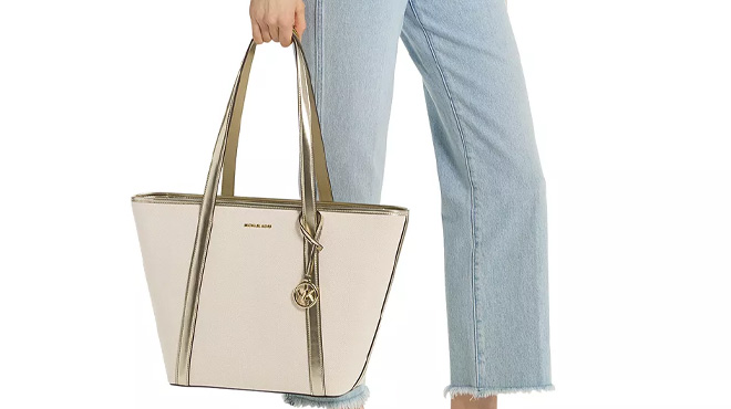 A Woman Holding Michael Kors Jet Set Travel Large Top Zip Tote