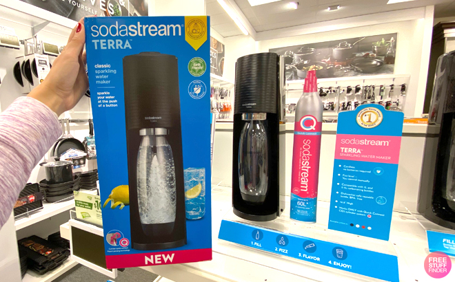 A Woman Holding SodaStream Terra Sparkling Water Maker Bundle
