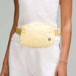 A Woman Wearing Lululemon Everywhere Belt Bag in Swirl Yellow