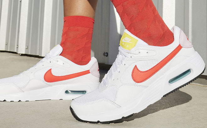 A Woman Wearing Nike Air Max SC Sneakers