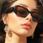 A Woman Wearing Trendy Retro Sunglasses