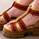 A Woman Wearing UGG Ashton Heritage Braid Sandals