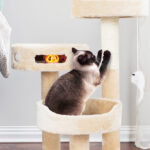 A cat Scratching the stem of the Petsmart 3 Tier 27 5 Cat Tree