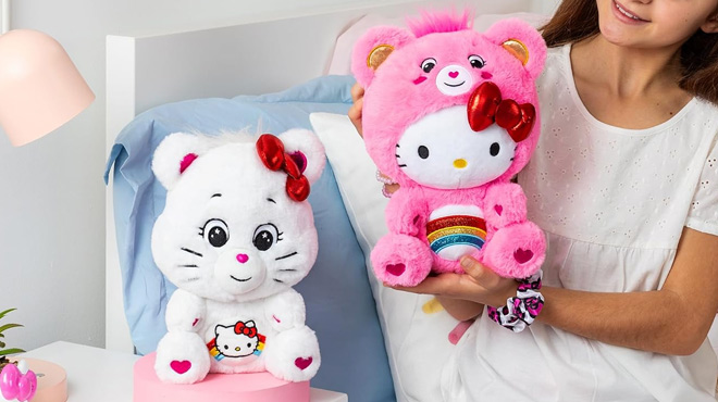 A Person holding Care Bears Hello Kitty Plush 2 Pack A Person holding Care Bears Hello Kitty Plush 2 Pack