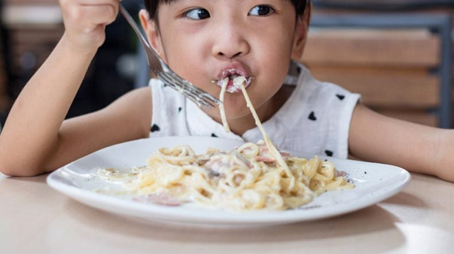Child Eating at a Restaurant