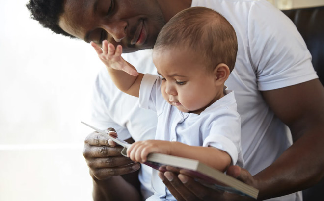 Father Reading to his Baby Father Reading to his Baby