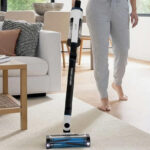 Lady cleaning with Shark Pro Cordless Vacuum