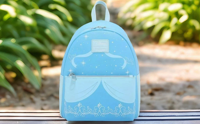 Loungefly Disney Cinderella Dress Filigree Mini Backpack on a Bench