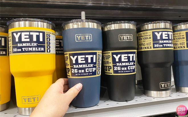 Person Holding YETI Rambler 26 Ounce Cup on a Store Shelf