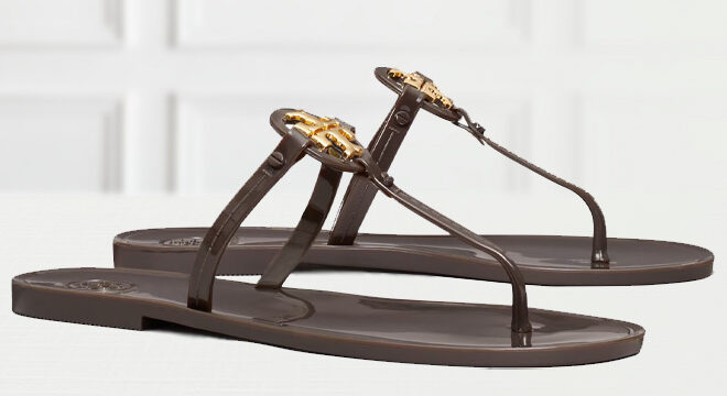 Tory Burch Mini Miller Jelly Sandal in Coco Gold Color on the Table
