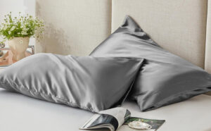 Two Pillows with Satin Pillowcases on a Bed