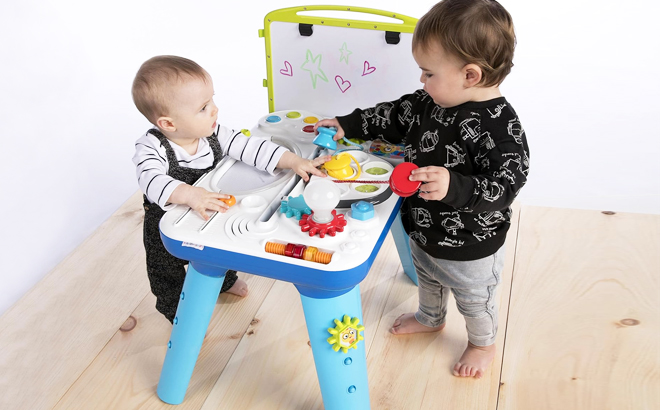 Two Toddlers Playing with Baby Einstein Curiosity Activity Table