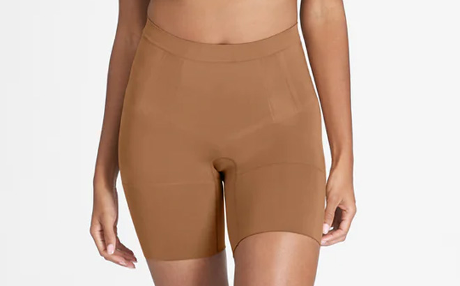 a Person Wearing Spanx OnCore Sculpting Mid Thigh Shorts