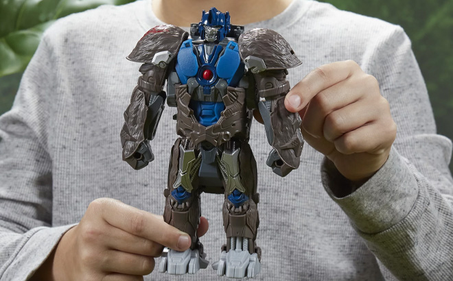 A Kid is Holding Transformers Rise of the Beasts Optimus Primal Kids Toy Action Figure