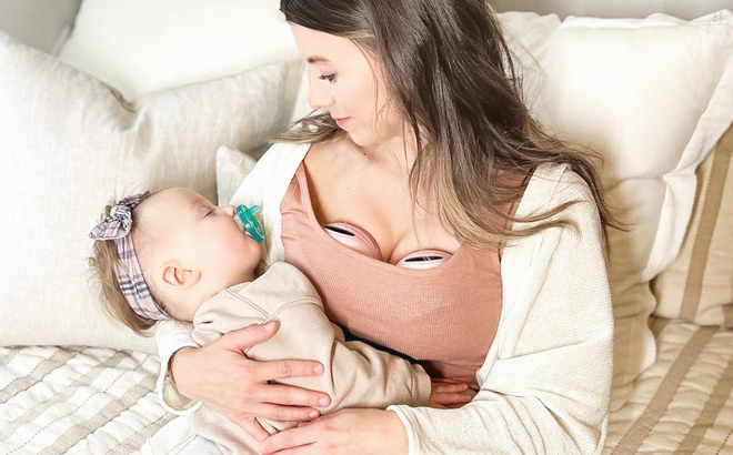 A Mother Wearing a MomMed Double Wearable Breast Pump A Mother Wearing a MomMed Double Wearable Breast Pump