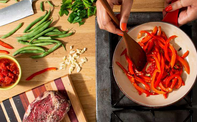 A Person Cooking Fresh Vegetables A Person Cooking Fresh Vegetables