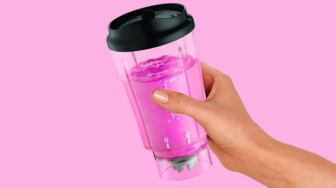 A Person Holding a Black Hamilton Beach Personal Blender
