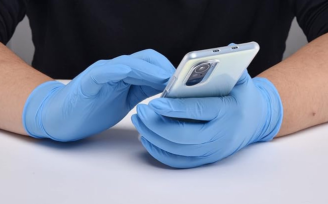 A Person Wearing Blue Nitrile Gloves