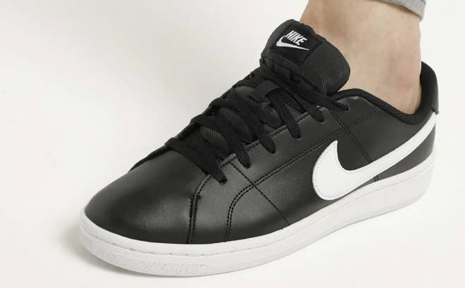 A Person Wearing Nike Court Royale 2 Sneaker A Person Wearing Nike Court Royale 2 Sneaker