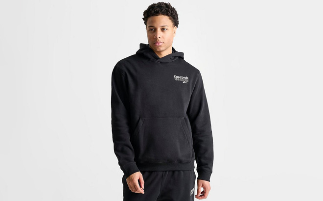 A Person Wearing Reebok Stack Logo Hoodie in Black Color