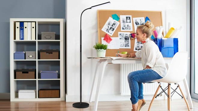 A Woman Writing under a Dimut LED Floor Lamp A Woman Writing under a Dimut LED Floor Lamp