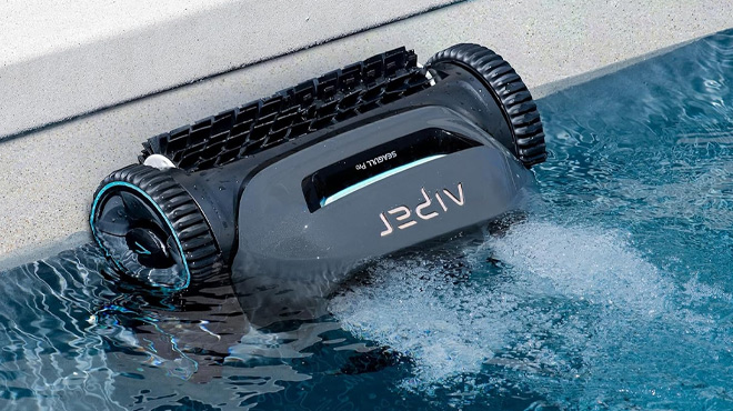 Cordless Robotic Pool Cleaner Cleaning a Pool Cordless Robotic Pool Cleaner Cleaning a Pool