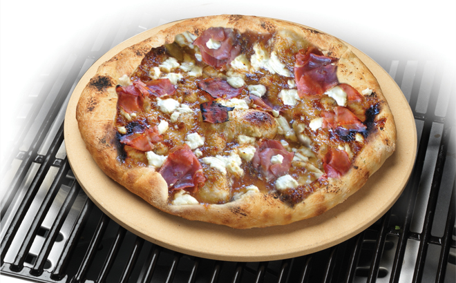 Cuisinart Pizza Grilling Stone on a Grill with Pizza on it