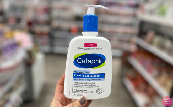 Person holding a Bottle of Cetaphil 16 oz Daily Facial Cleanser