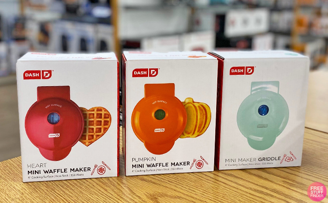 Three Dash Mini Waffle Makers on a Table Three Dash Mini Waffle Makers on a Table