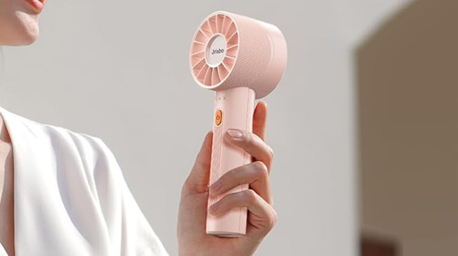 a Person Holding High Speed Mini Handheld Fan a Person Holding High Speed Mini Handheld Fan