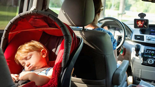 A Person Driving with a Baby while Using a Baby Car Camera